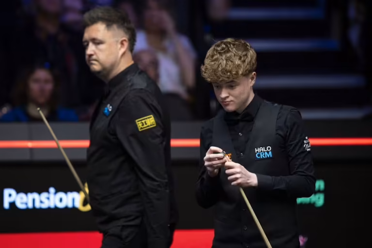 sheffield-england-kyren-wilson-of-england-and-stan-moody-of-england-at-the-table-during-day-6873995